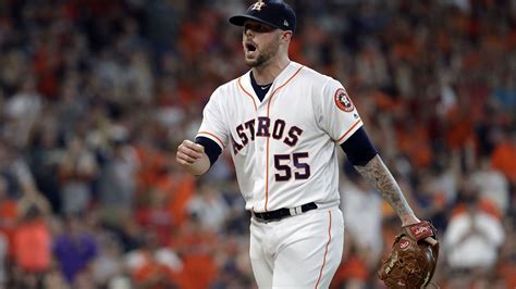 Houston Astros pitcher Ryan Pressly reacts after fielding a ground ball ...