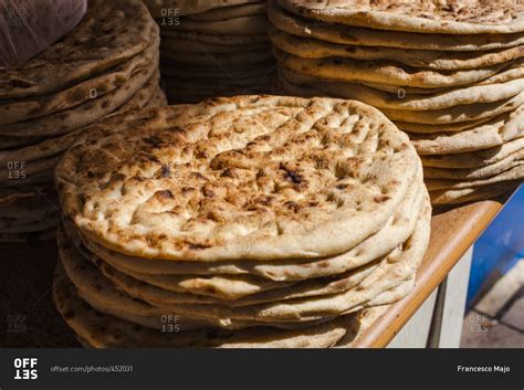 Stacks of fresh baked Arabic bread stock photo - OFFSET