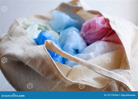 Multi-colored Blue, Red, White Plastic Bags in a Rag Cotton Bag Stock Photo - Image of delivery ...