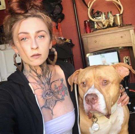 Woman with Tattoos and Pitbull