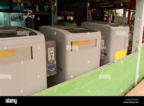 coin operated washing machine Stock Photo - Alamy