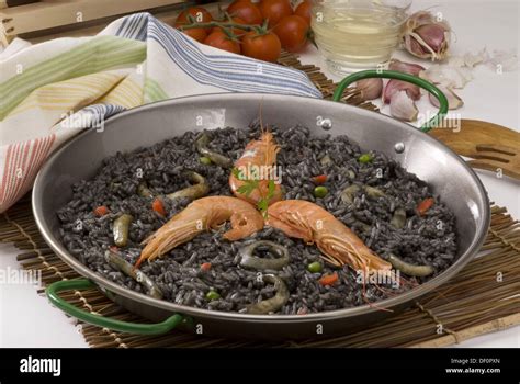 Spanish Cuisine Arròs negre Arroz negro Black rice with garlic mayonnaise Stock Photo - Alamy