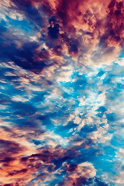 Fondo de pantalla HD de cielo con colores azules abstractos de nubes irreales · Creative Fabrica