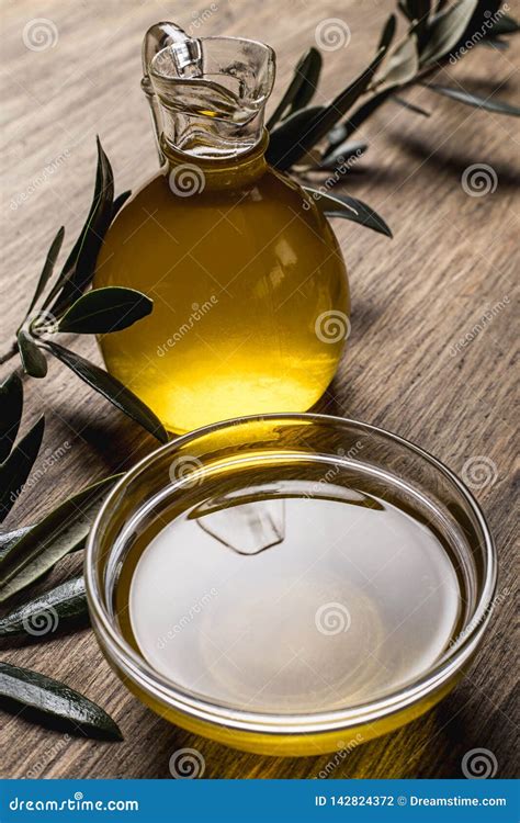 Olive Oil and Leaves on a Wooden Table Stock Photo - Image of organic ...