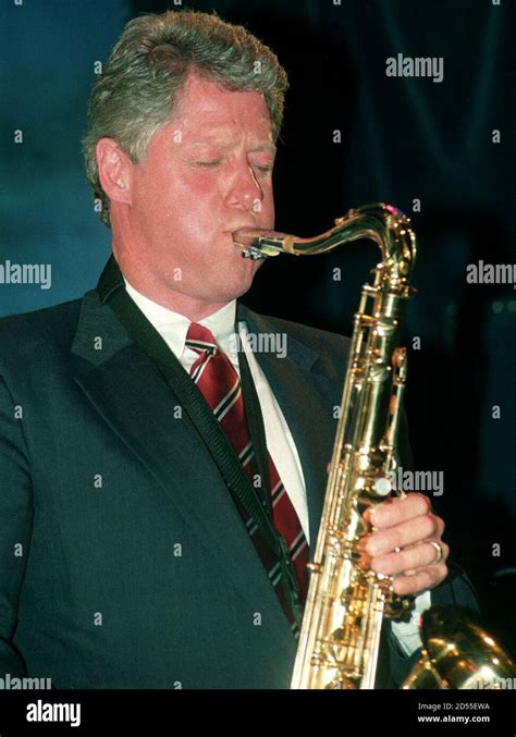 President bill clinton plays saxophone hi-res stock photography and ...