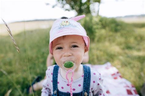 Funny Little Girl with a Pacifier in Her Mouth Stock Image - Image of funny, children: 179828615