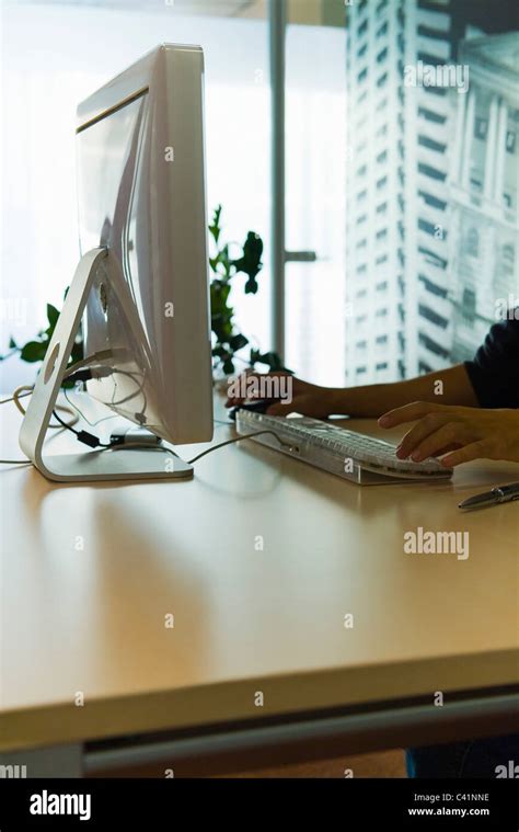 Person using desktop computer in home office Stock Photo - Alamy