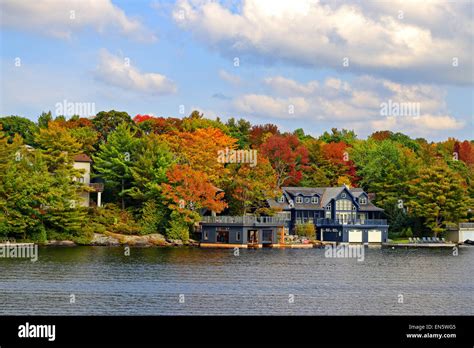 Million dollar cottages along Lake Moskoka near Gravenhurst, Ontario, in autumn. Photographed on ...