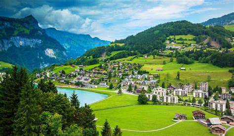 Houses Lake Town Alps Forest Buildings Switzerland Mountains Grass Green Clouds Beautiful Cliffs ...