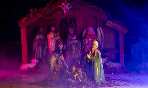 Christmas Jesus in Crib. Christmas Nativity Scene of Born Jesus Christ in the Manger with Joseph ...