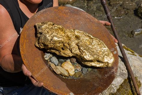 Gold Nugget mining from the River — Stock Photo © Luftklick #113218382