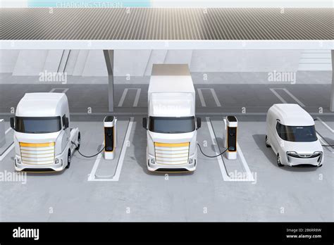 Front view of generic design Heavy Electric Trucks charging at Public Charging Station with roof ...