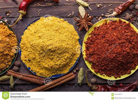 Heaps of Various Ground Spices on Wooden Background. Georgian Spices, Indian Spices, Arabian ...