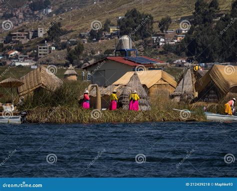 The Uros Indigenous Family Help To Unmoor The Traditional Boat Made Of Totora Reeds Editorial ...