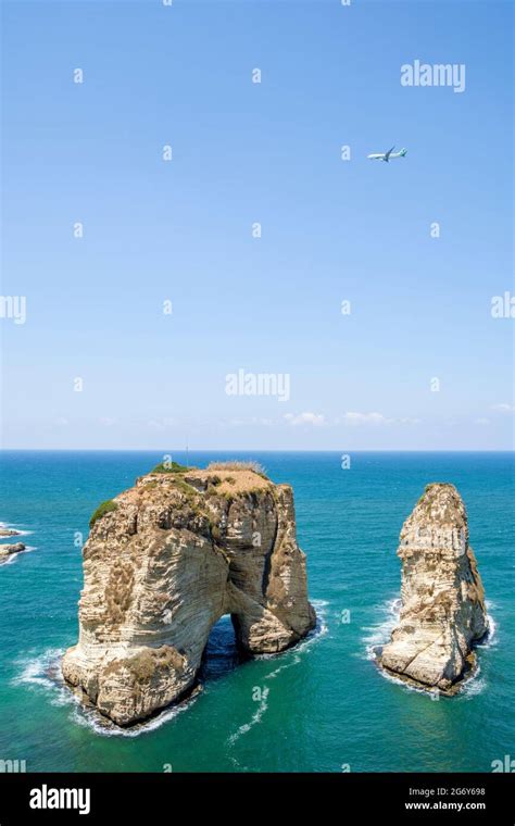 Commercial aircraft flying over Pigeon rock, Raouche, Beirut, Lebanon Stock Photo - Alamy