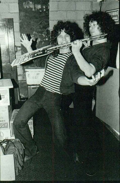 Alex and Eddie Van Halen messing around backstage with a cardboard ...