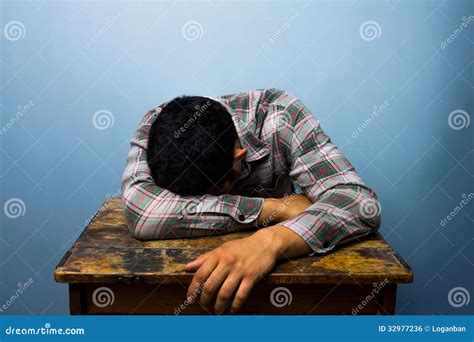 Young Man Sleeping At Desk Stock Photo | CartoonDealer.com #32977236