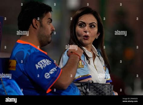 Nita Ambani and her son Anant Ambani talk as they watch the Indian Premier League (IPL) match ...