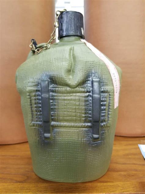 JIM BEAM PORCELAIN WHISKEY DECANTER IN THE SHAPE OF A ARMY CANTEEN