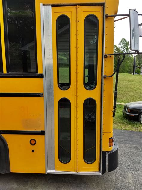 a yellow school bus parked in a parking lot