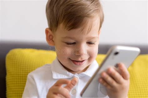 Close-up Happy Little Cute Preschool Baby Boy Talking Video Conference by Smartphone in Living ...