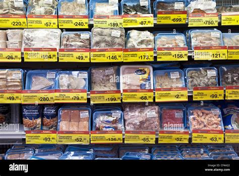 packages of large variety frozen seafood products displayed in fish ...