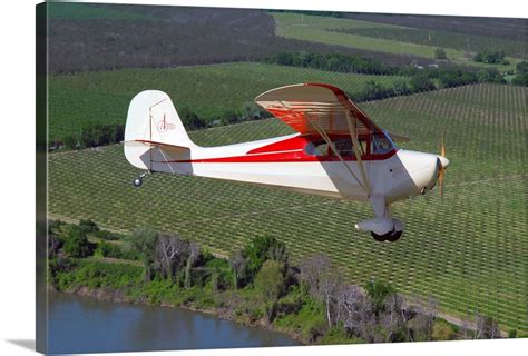 Aeronca Chief flying over Sacramento Valley, California Wall Art ...