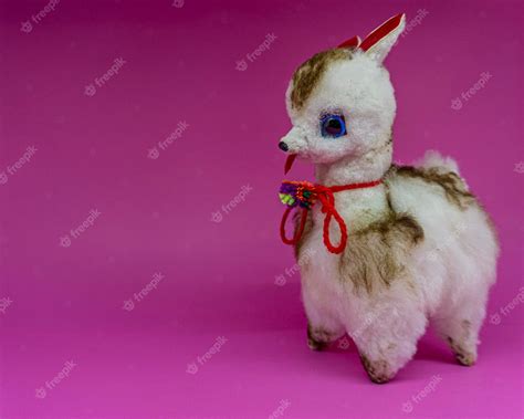 Premium Photo | White andean llama stuffed animal on a pink background