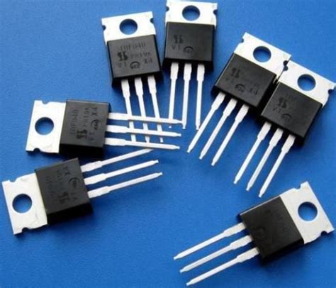 many different types of electronic components on a blue surface