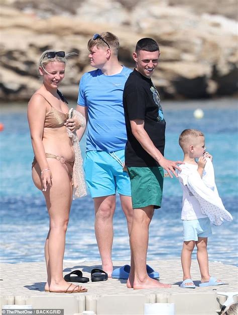 Shirtless Phil Foden soaks up the sun with his bikini-clad girlfriend ...