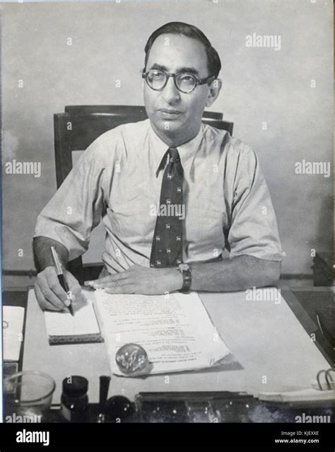 SM Ikram at his desk Stock Photo - Alamy