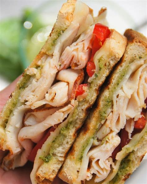 Crispy bread, melted cheese, piled high with turkey and tomatoes and finished with a bright and ...