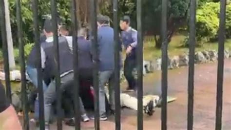 Moment pro-democracy protester was attacked at Chinese consulate in Manchester | UK News | Sky News