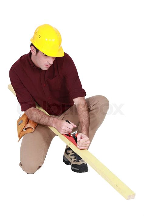 Carpenter using a plane | Stock image | Colourbox