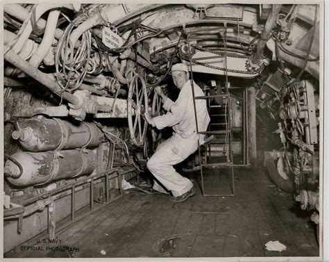 A U.S. sailor inside a midget submarine having a photo op. | Midget ...