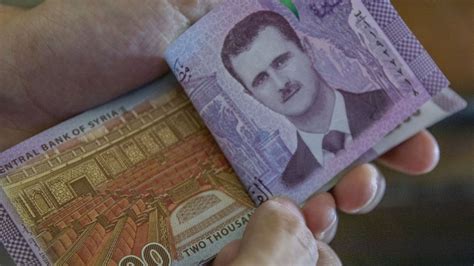 Report: Syrian Central Bank Devalues Local Currency by Nearly 50% ...