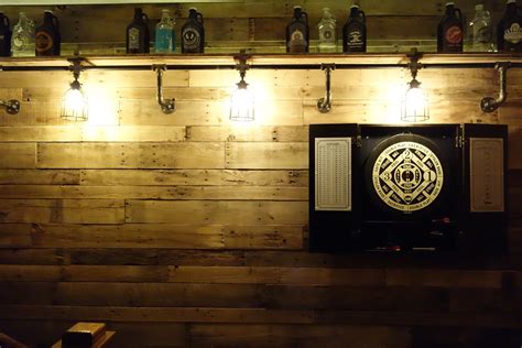 DIY pallet wall w/ beer growler collection & industrial Edison bulbs! Diy Pallet Wall, Beer ...