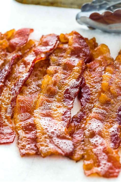 The essential step-by-step guide for how to cook bacon in the oven. Two ...