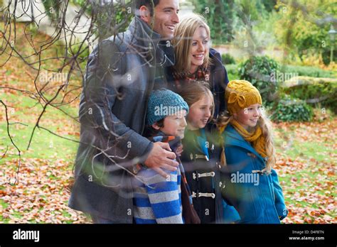 Family smiling together outdoors Stock Photo - Alamy