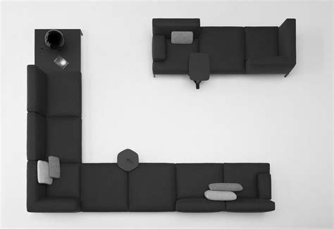 an overhead view of a living room with black furniture