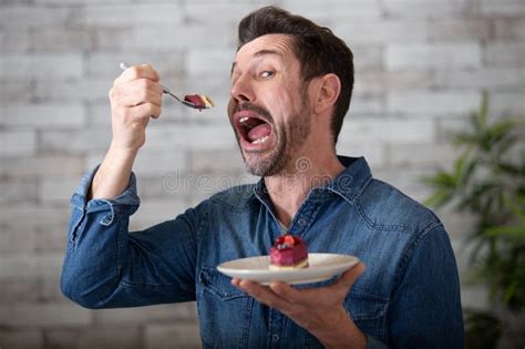 Man Posing with Mouth Open while Eating Cake Stock Image - Image of ...