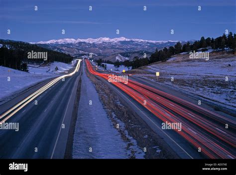 Streaking traffic lights on interstate highway in mountains outside ...