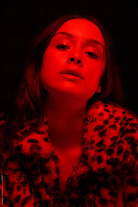 «Amazing Woman Portrait In Red Light» del colaborador de Stocksy «Ohlamour Studio» - Stocksy