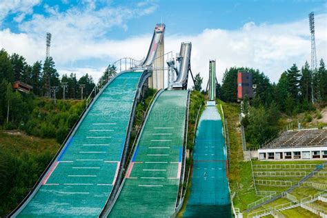 Lahti, Finland - 4 August 2020: Lahti Sports Centre with Three Ski Jump Towers. Sportsman is ...