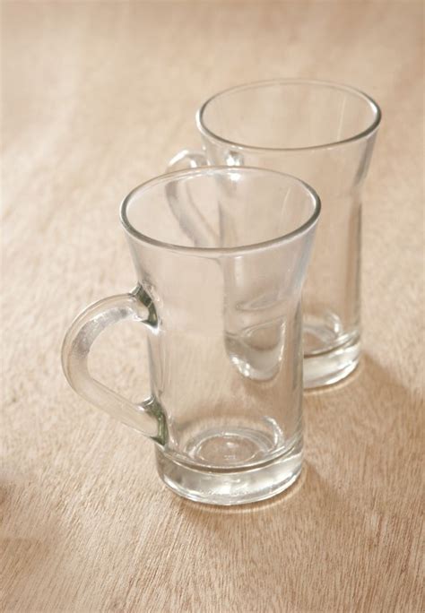 Two empty clean tea glasses with handles - Free Stock Image