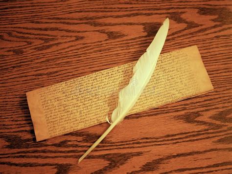 Parchment and Feather Quill for Writing on Wooden Desk Stock Photo ...