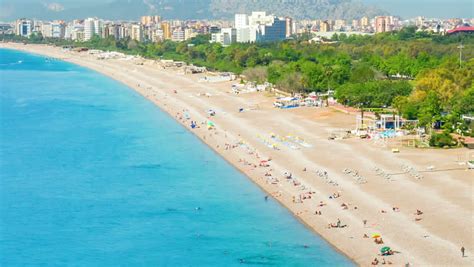 Many People Sunbathing On The Konyaalti Beach In Antalya And Bathing In ...