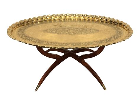 Mid-Century Modern round brass tray top coffee table. This beautiful tray table is mounted on a ...