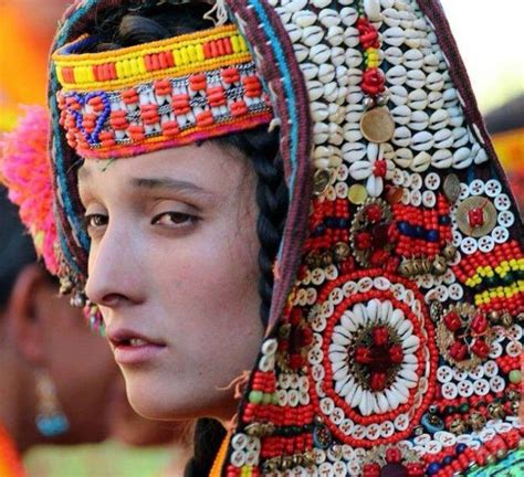 Kalash Pictures: A Kalash girl with colourful headdress made of cowrie shells -… | Kalash people ...