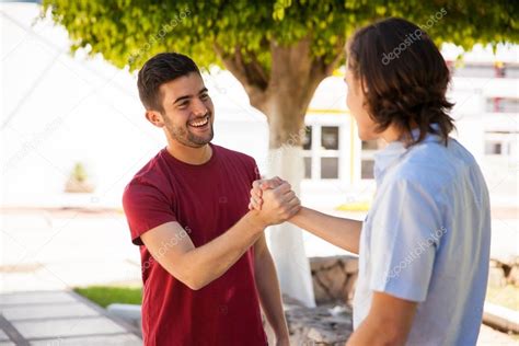 Friends greeting each other — Stock Photo © tonodiaz #72580893